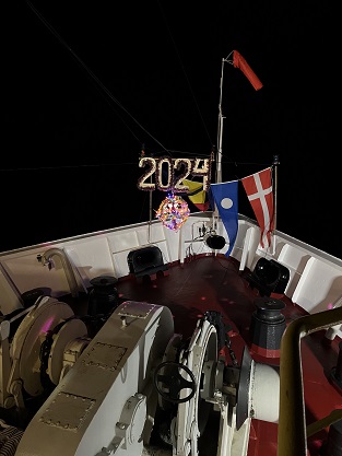 2024 written in lights on the bow of the JOIDES Resolution